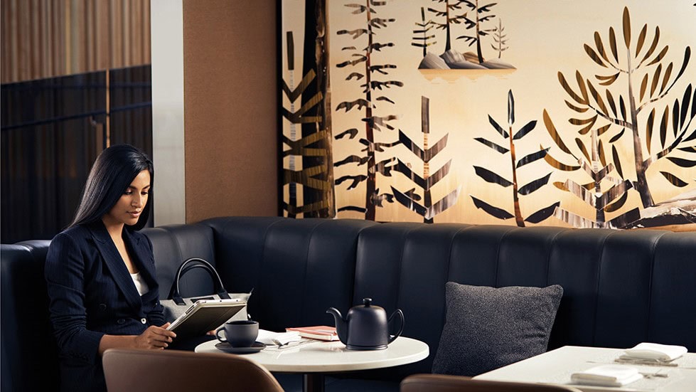 woman on her laptop at Air Canada - Signature Suite, Toronto Pearson International Airport, Toronto