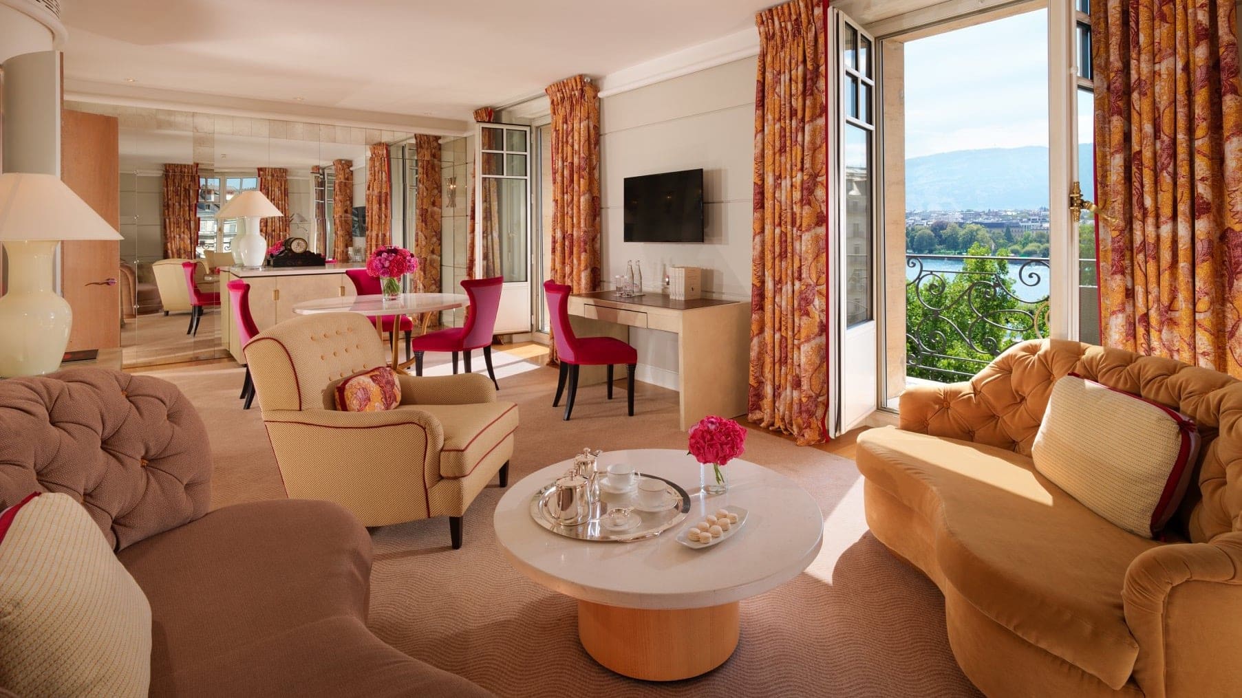 Suite at Le Richemond with view of the city with pink chairs