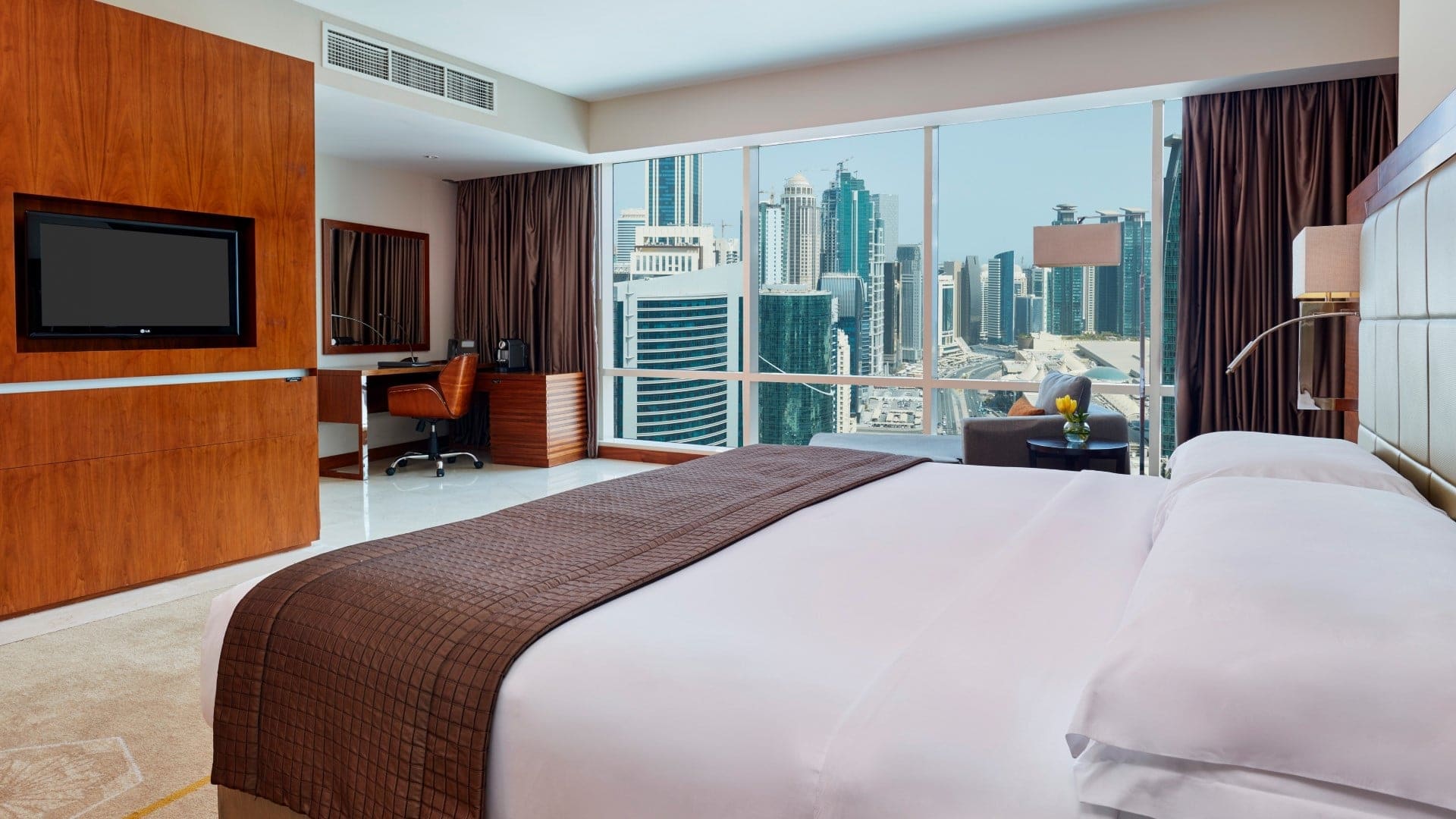 a suite at InterContinental Doha Beach & Spa with large windows