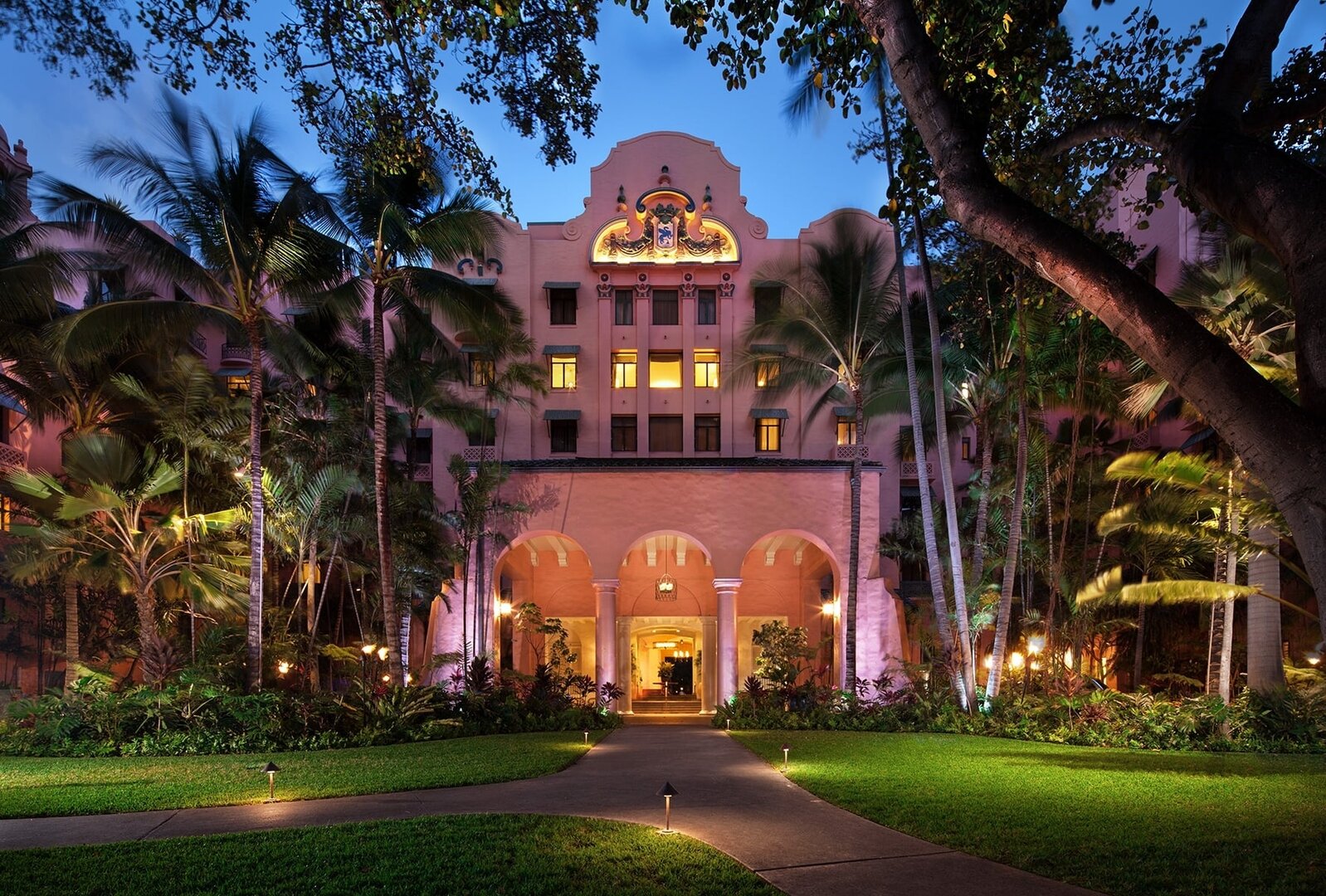 Outside The Royal Hawaiian, a Luxury Collection, Resort, Waikki with entrance and the pink hotel.
