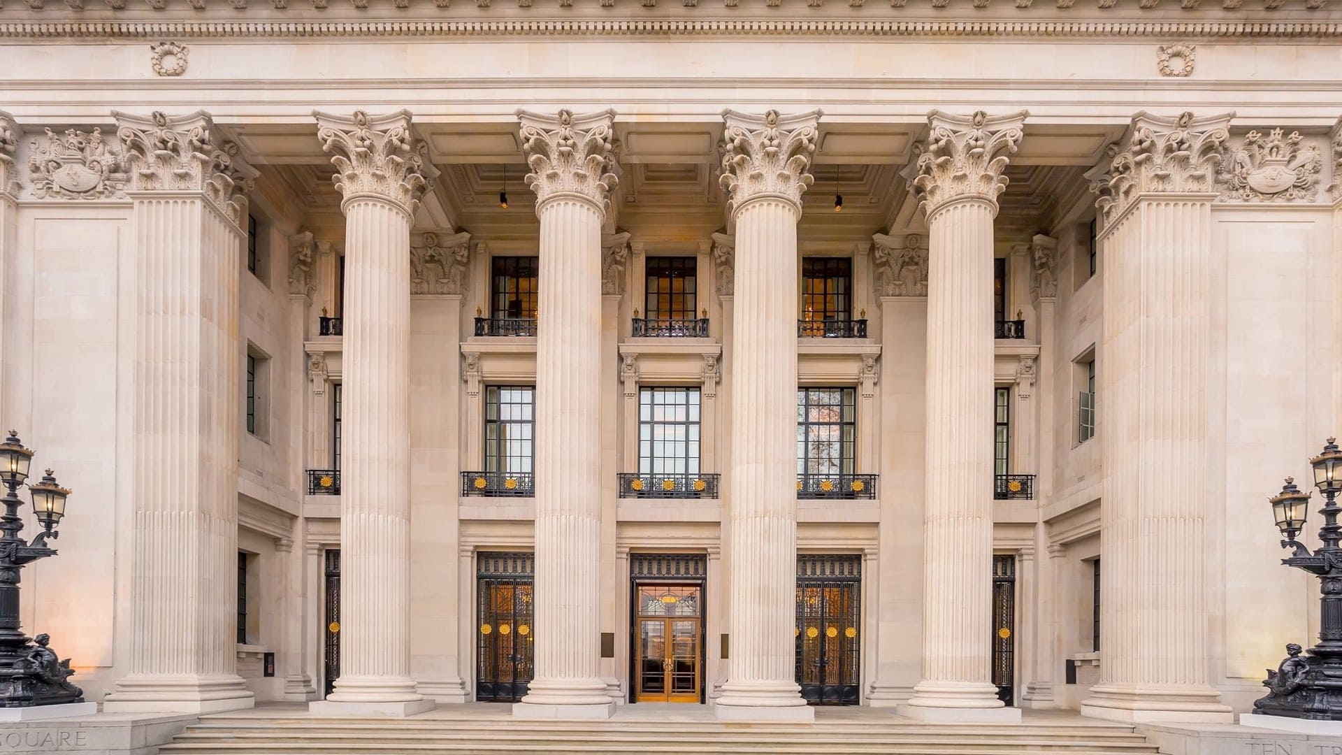 Front entrance of the four seasons hotel london at ten trinity square with large white columns