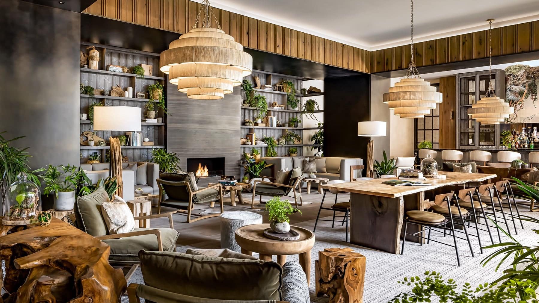 A relaxing/working space with a fireplace and plants at the 1 hotel toronto