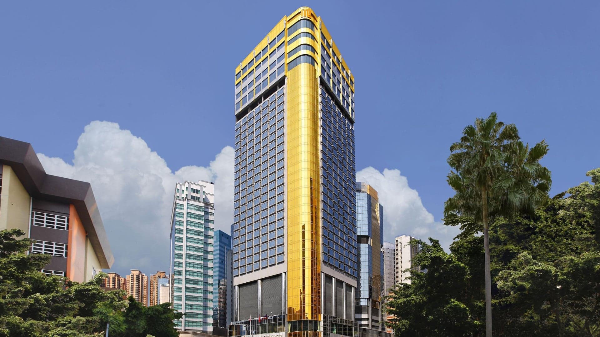 Gold and Black building with flags of different countries at Regal Airport Hotel