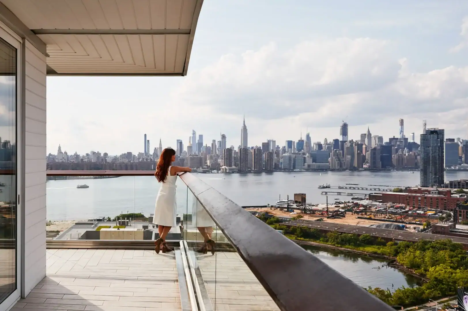 woman standing on a terrace at the william vale new york