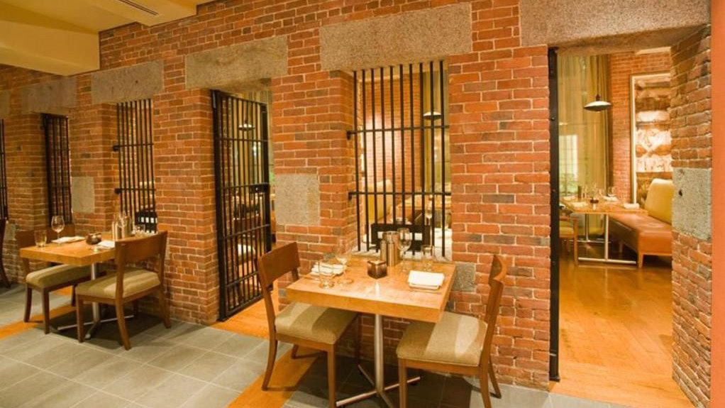 A dining area in the liberty with a stone brick finish.