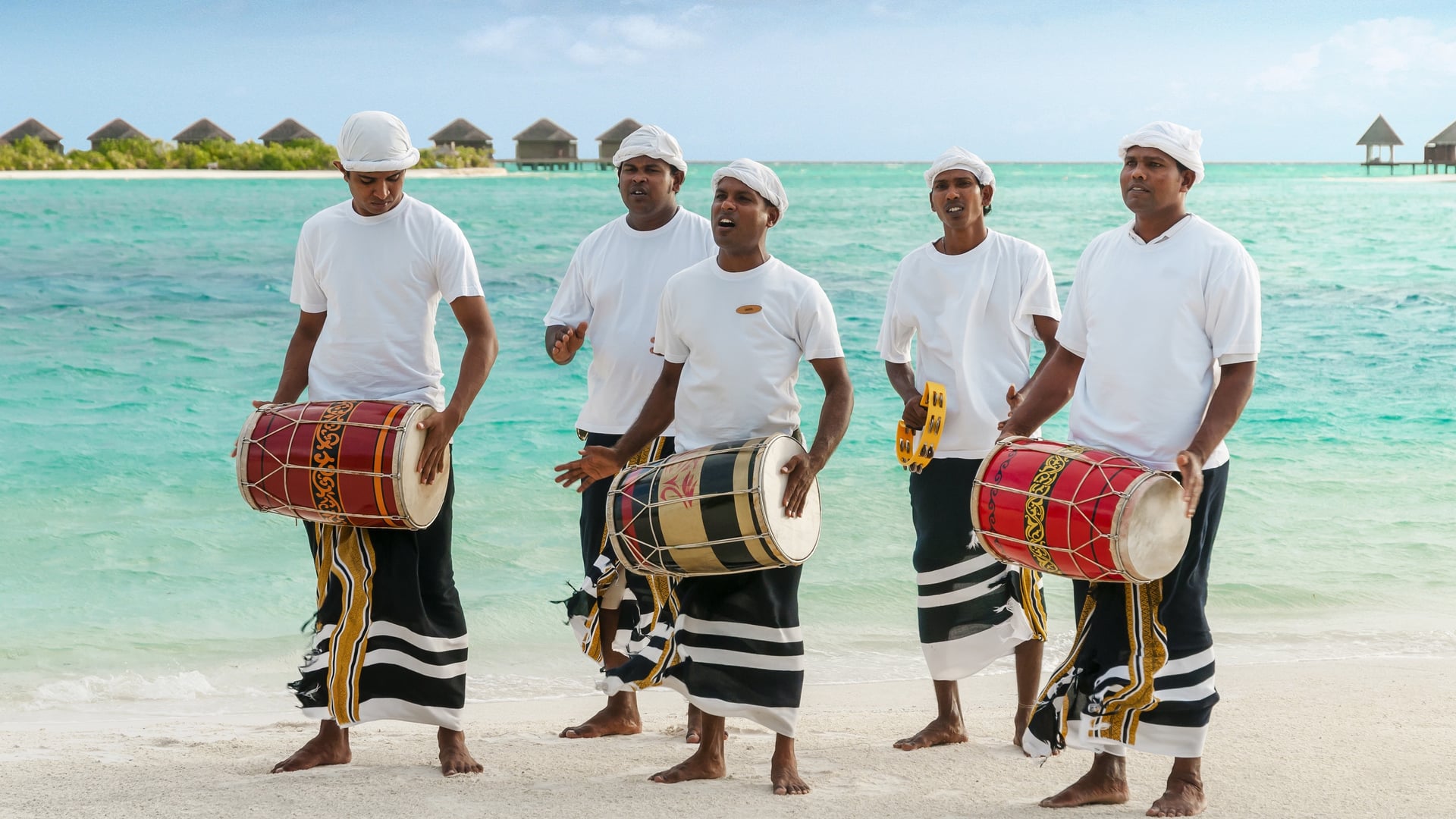 natives playing the drums