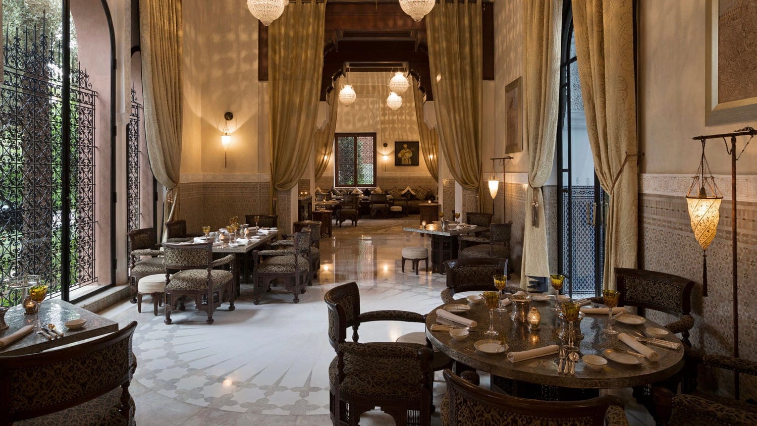 A resturant high under the ceiling with yellow walls and courtains and white floor.