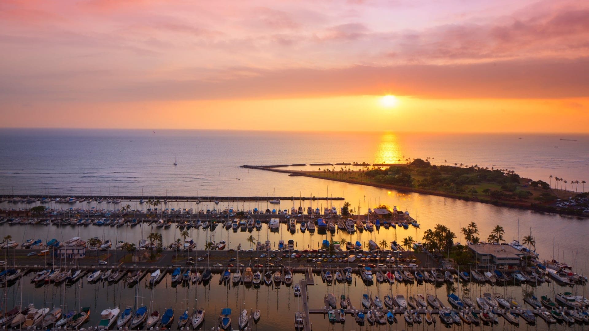 Bird view of a shore with hundreds boats and sailboats at Prince Waikiki.