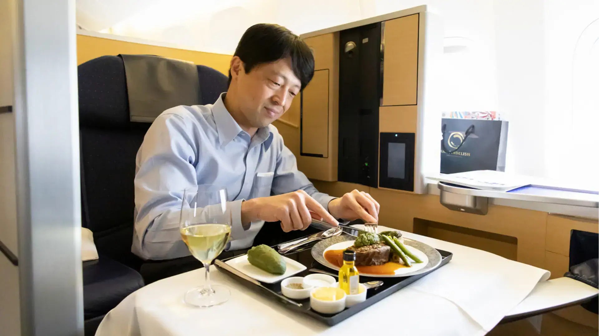 a man having steak in ana first class