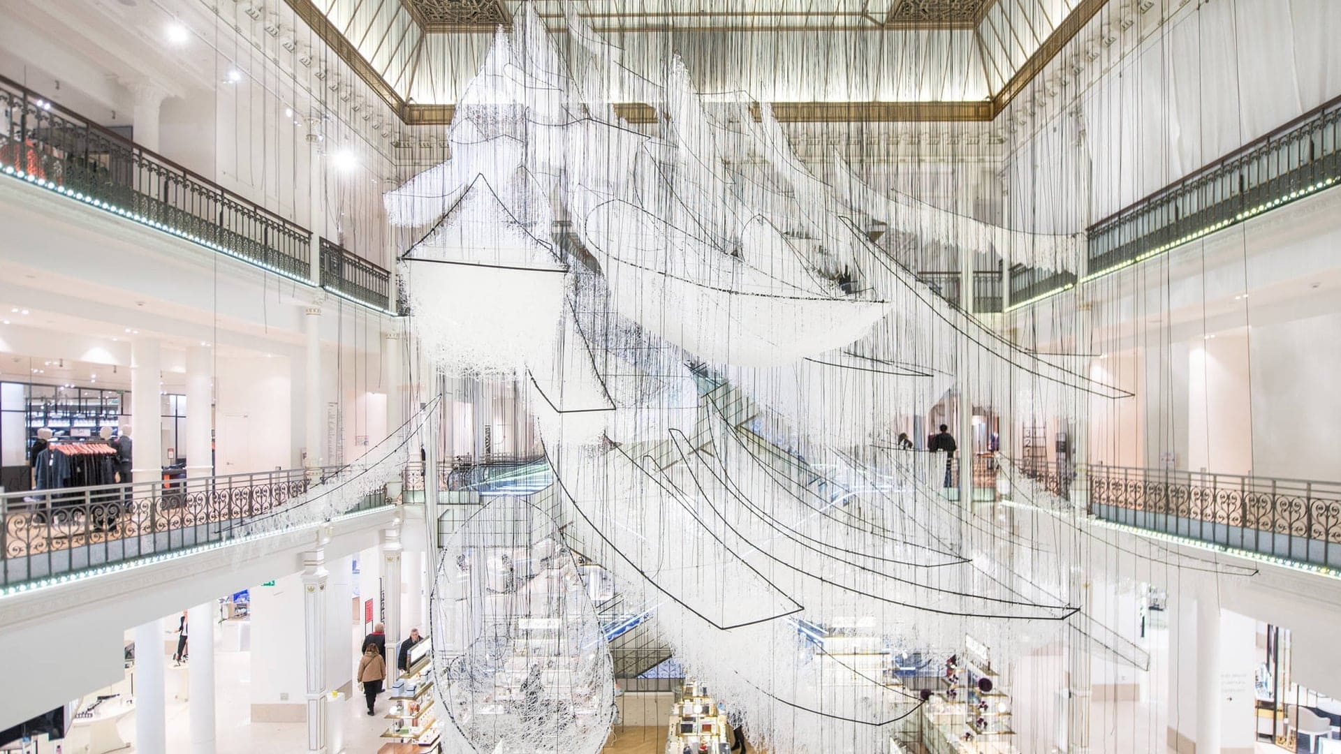 Glass sculpturr hanging down from roof at The Mori Art Museum.