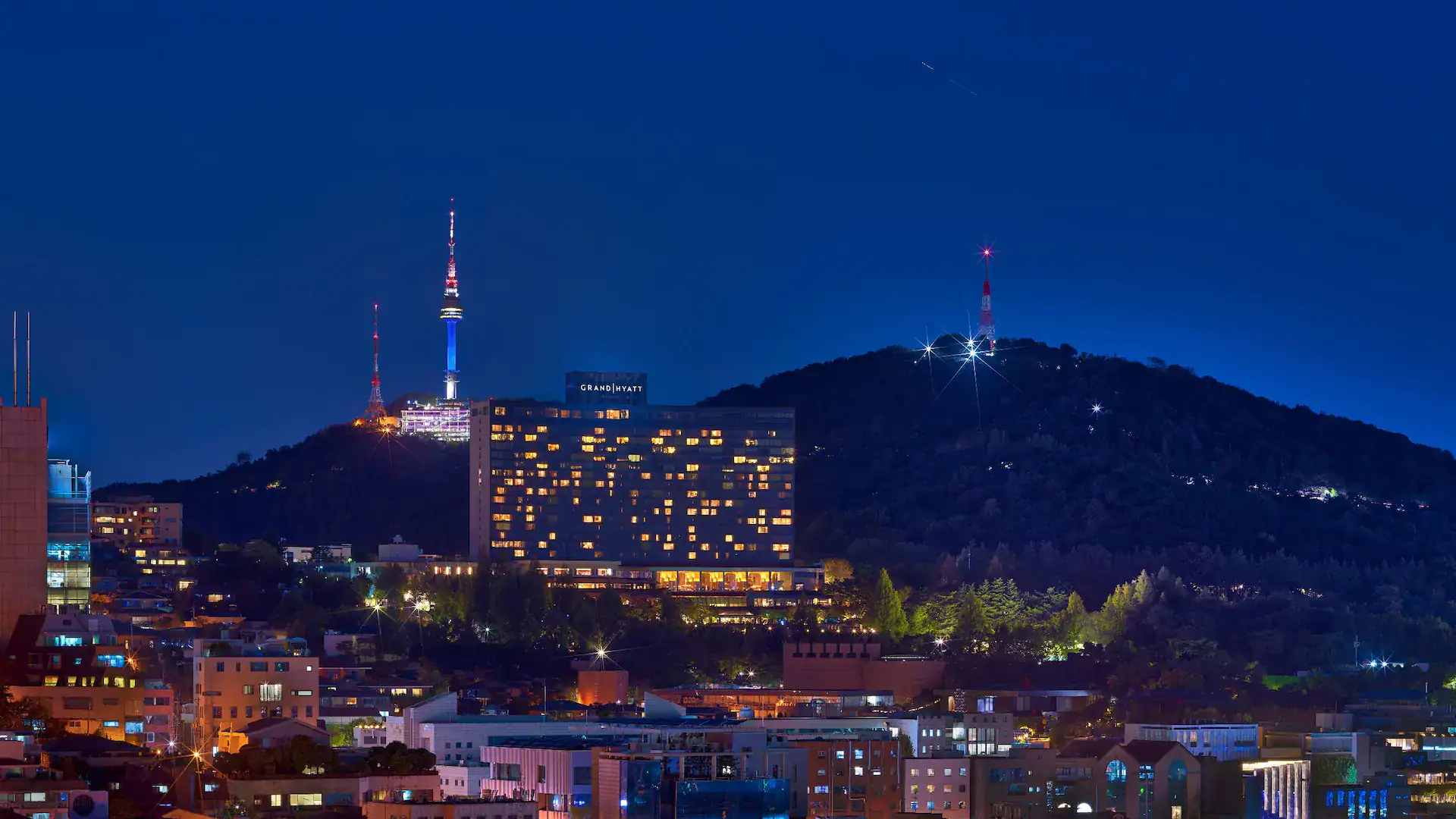Grand hyatt hotel seoul seen from a distance 