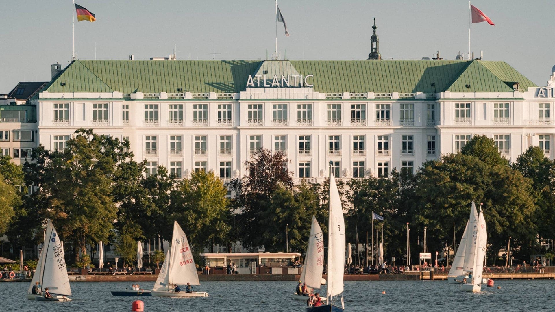 Water view to Hotel Atlantic, sailboats and large hotel