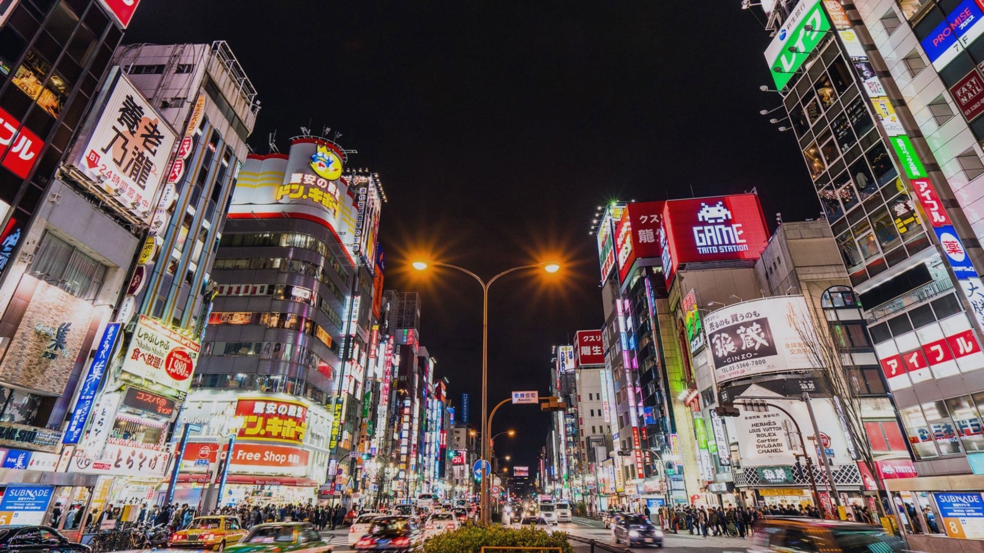 City lights, busy street, and advertisements at Shinjuku.