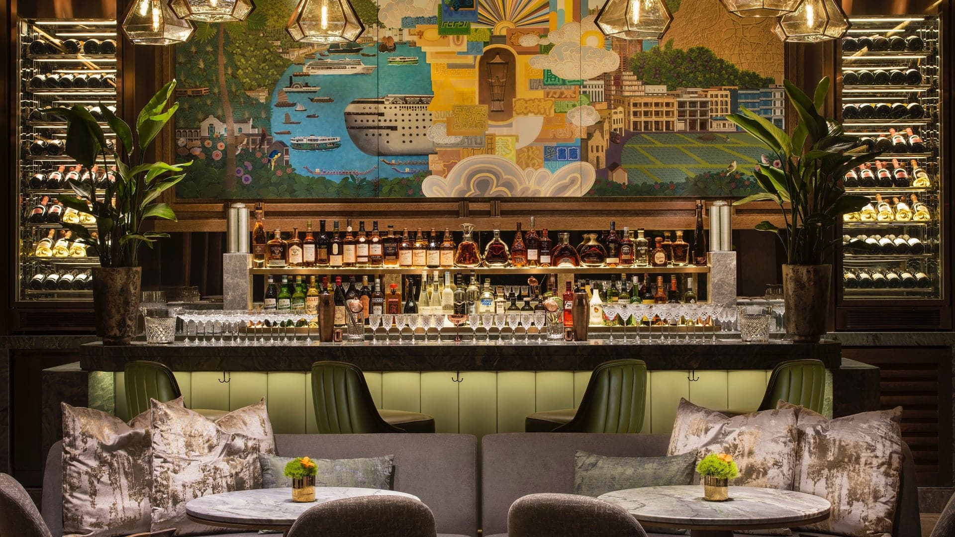 Bar area with painted wal, grey sofa and two wine fridgerators at The St Regis Hong Kong.