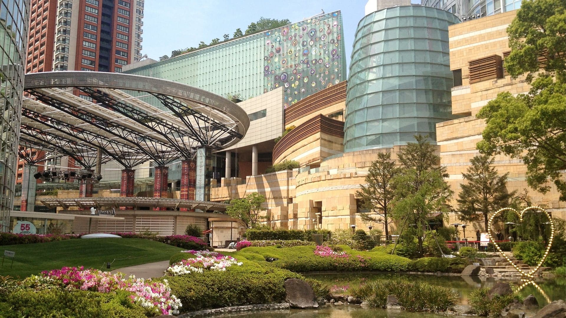 Roppongi Hills with a heart in the lake, large shopping centre.