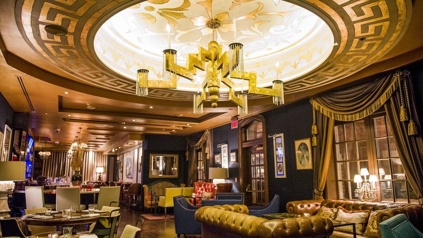 Resturant at the windsor arms hotel toronto with a brown ceiling and blue and gold decor