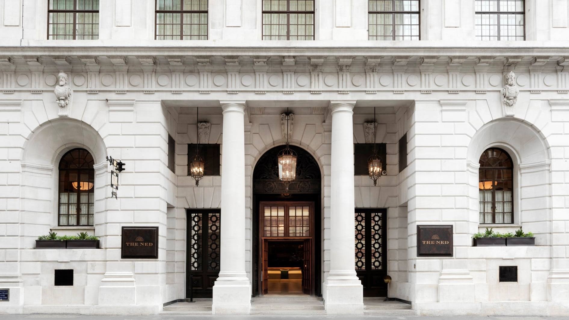 Front entrance of the ned london with two big columns in front