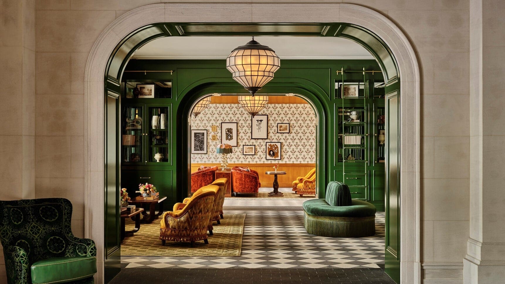 Tea area with two different rooms. One with green walls and yellow furniture and one with Yellow walls with decoration and red chairs.