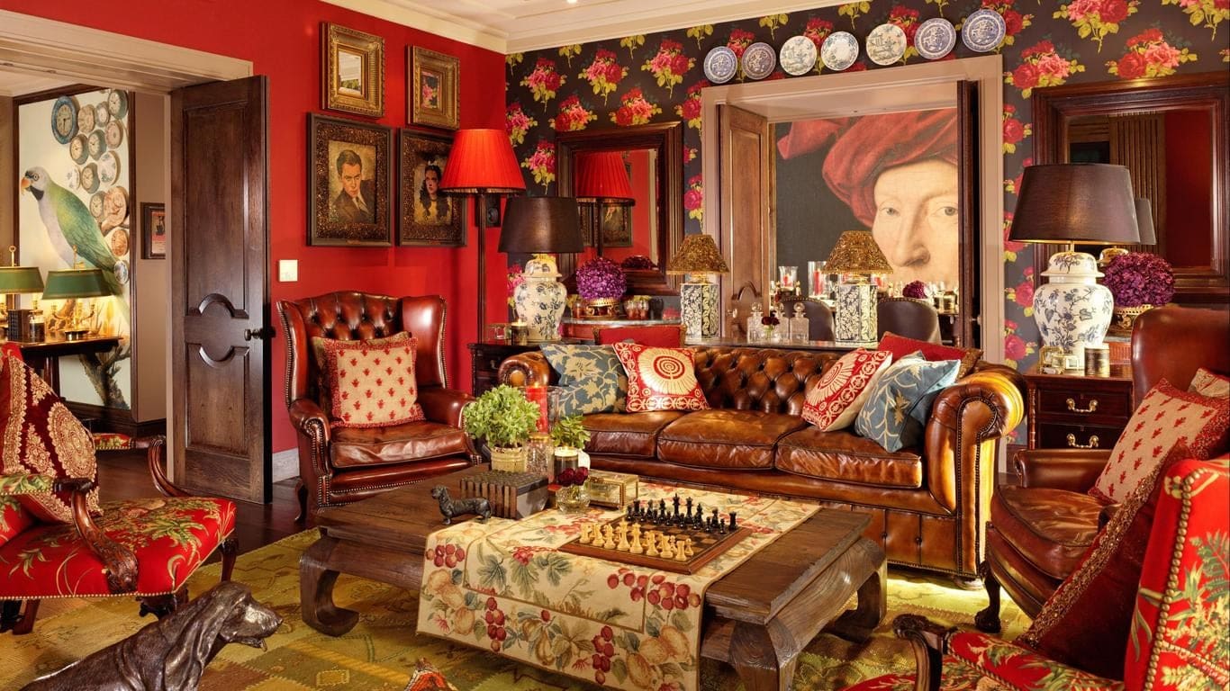 A relaxing area with red and brown decor at Taj 51 Buckingham Gate Suites and Residences London