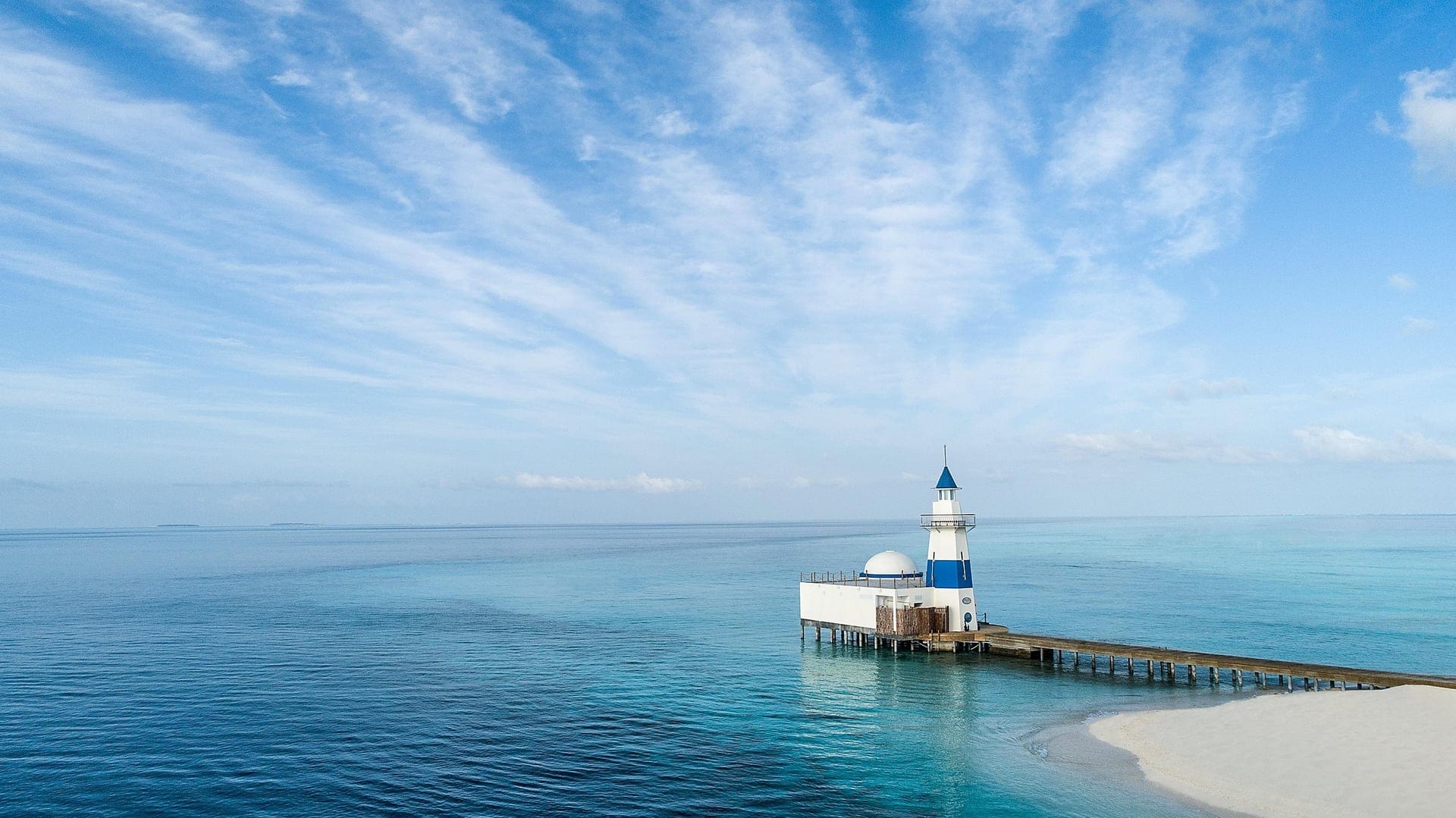 Blue and white boat tower at InterContinental Maamungau Resort.