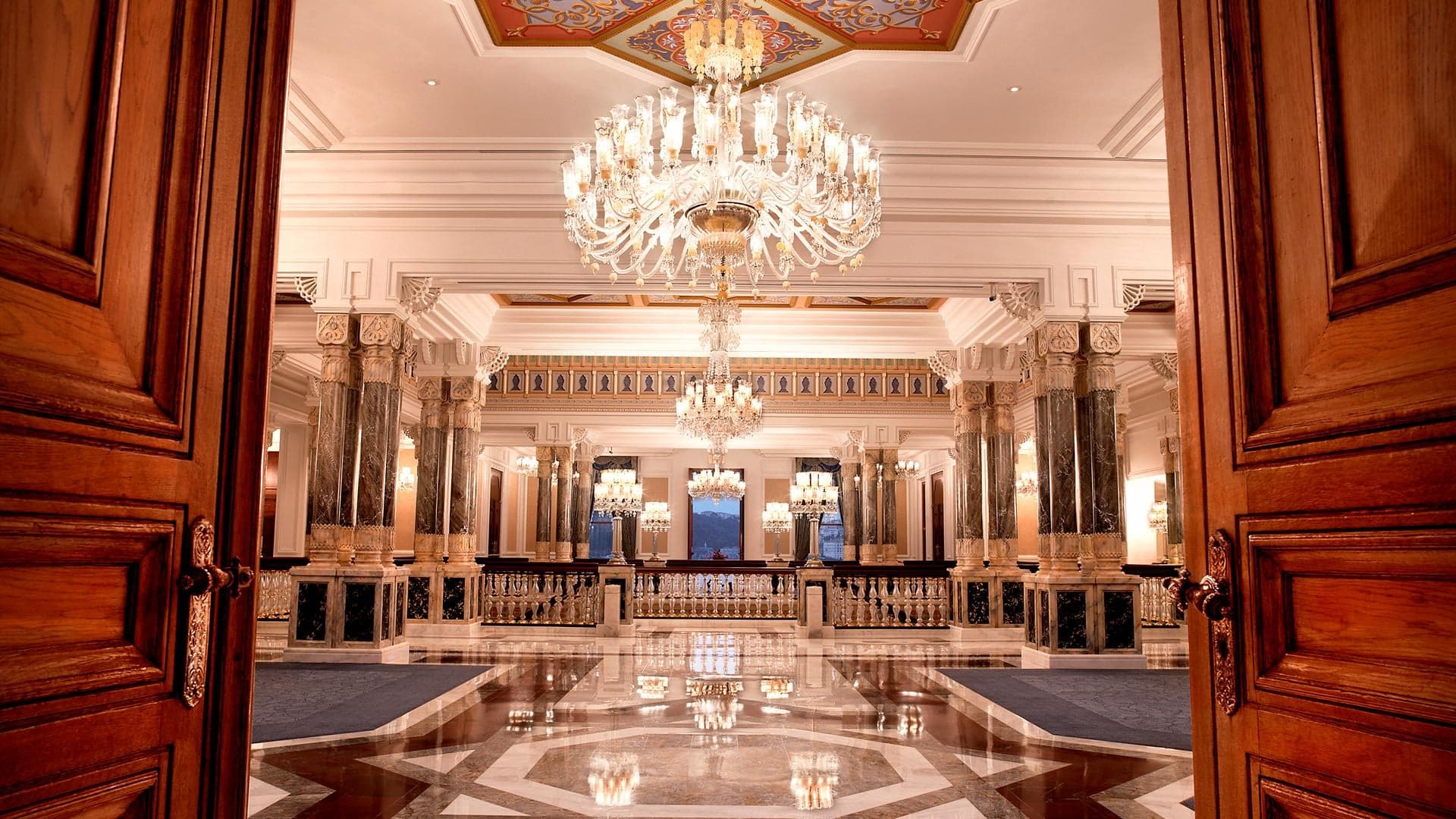 Grand entrance and lounge of the majestic Çırağan Palace offering a luxerious feel with it's marble floors and interior, large lamps and good space