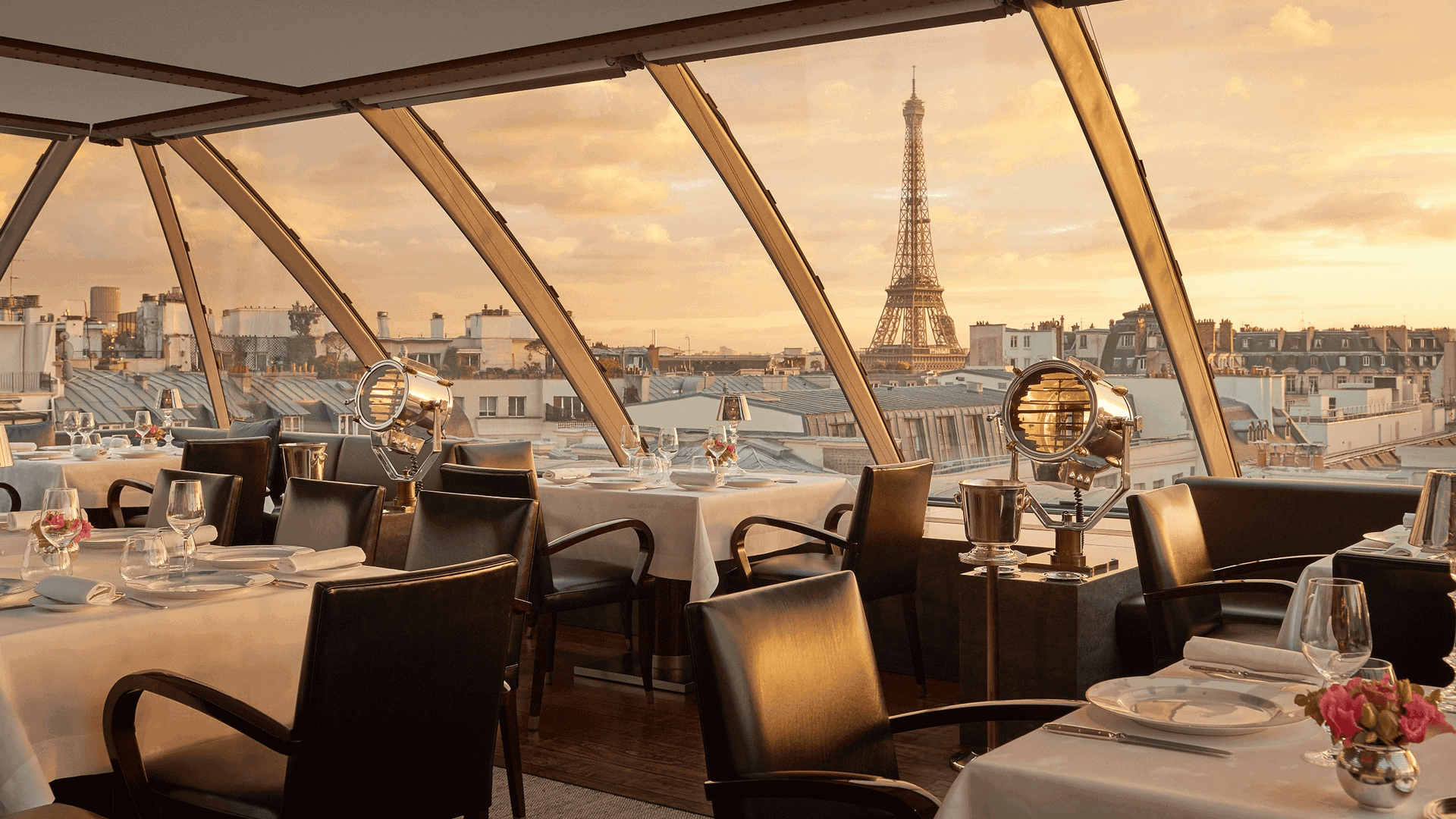 Resturant Loiseau blanc paris with black tables and view of the eiffel tower