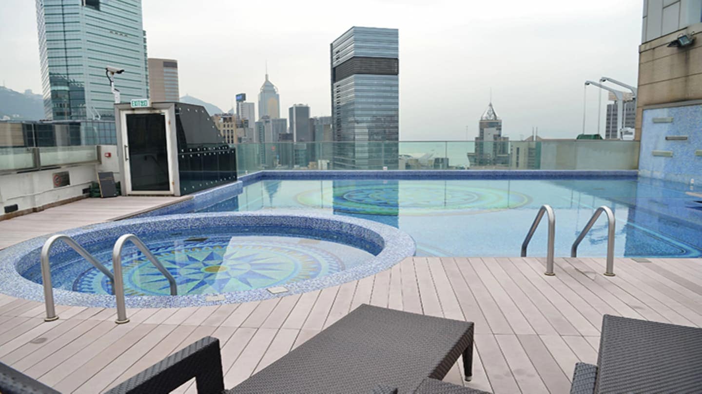 Rooftop pool area with view to Hong Kong at Regal Airport Hotel