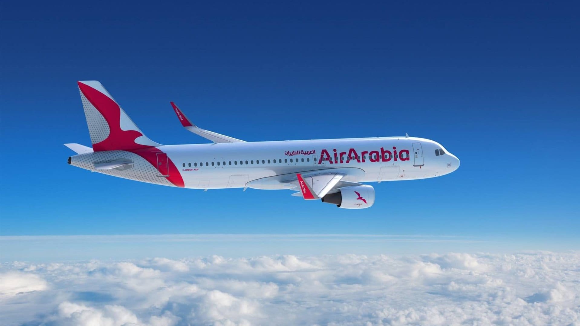 Air Arabia plane in the sky between the clouds