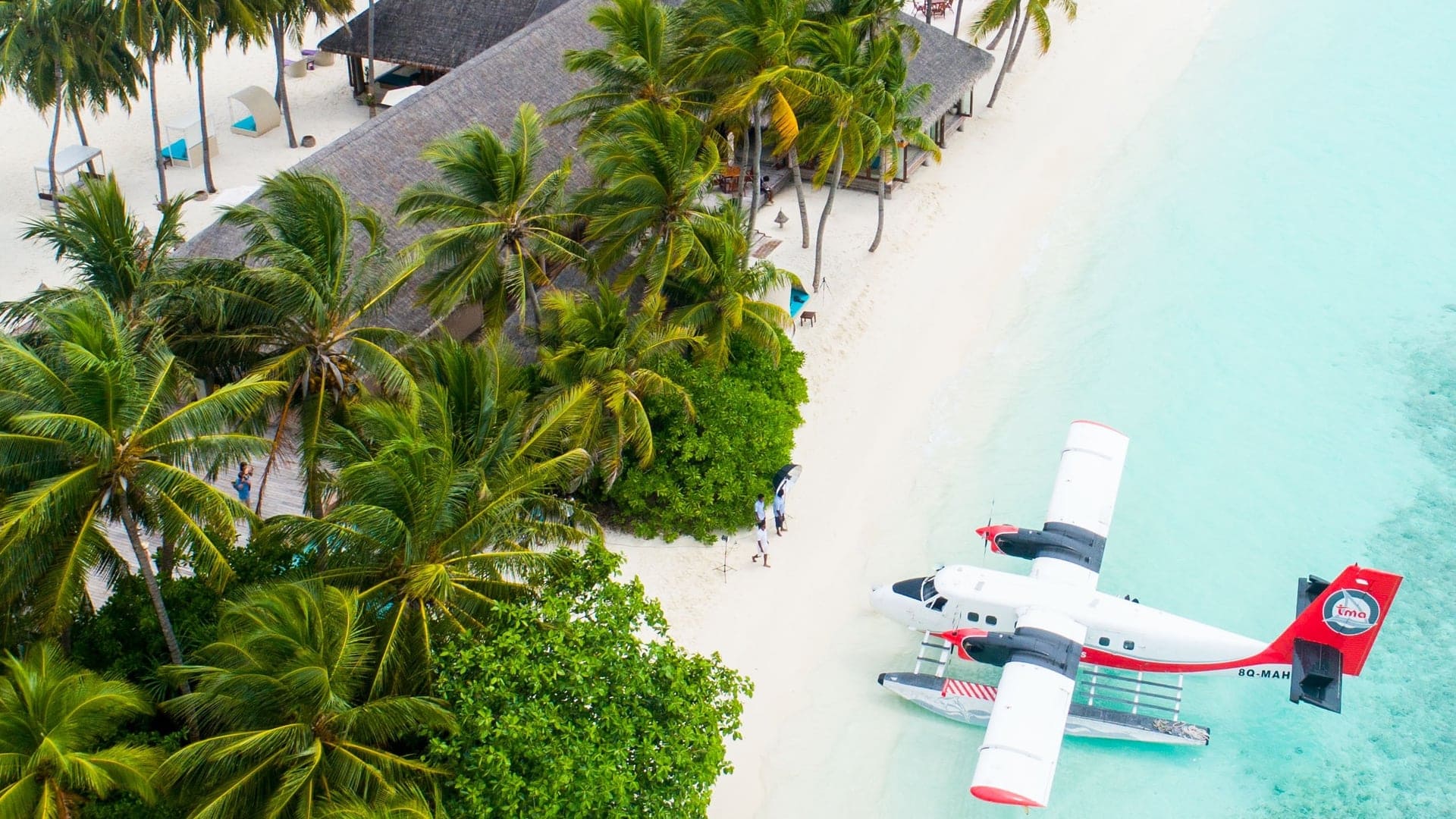 a seaplane at the bank of the beach waiting for its passengers