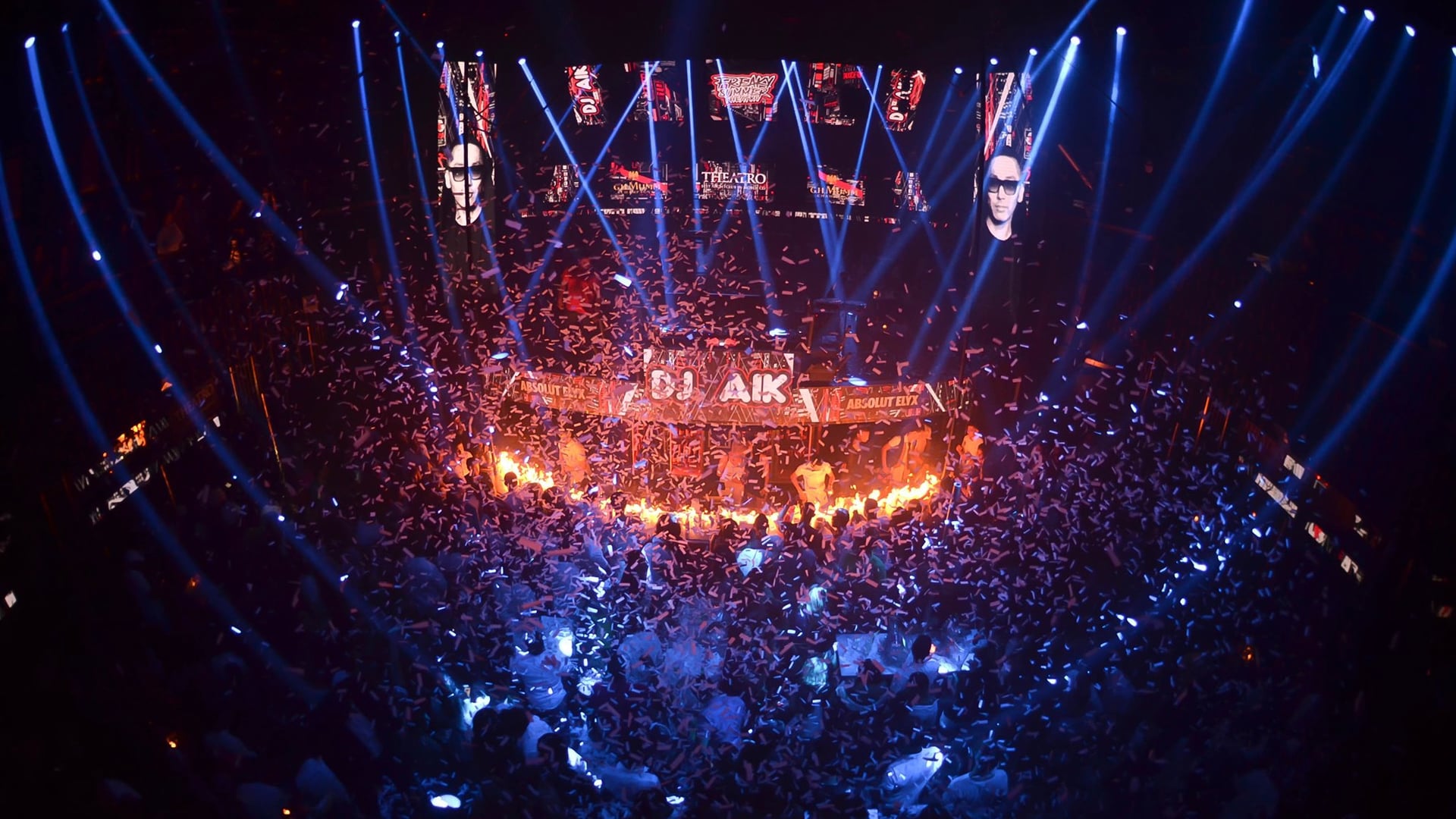 A club with blue neon lights and confetti with DJ aik written.