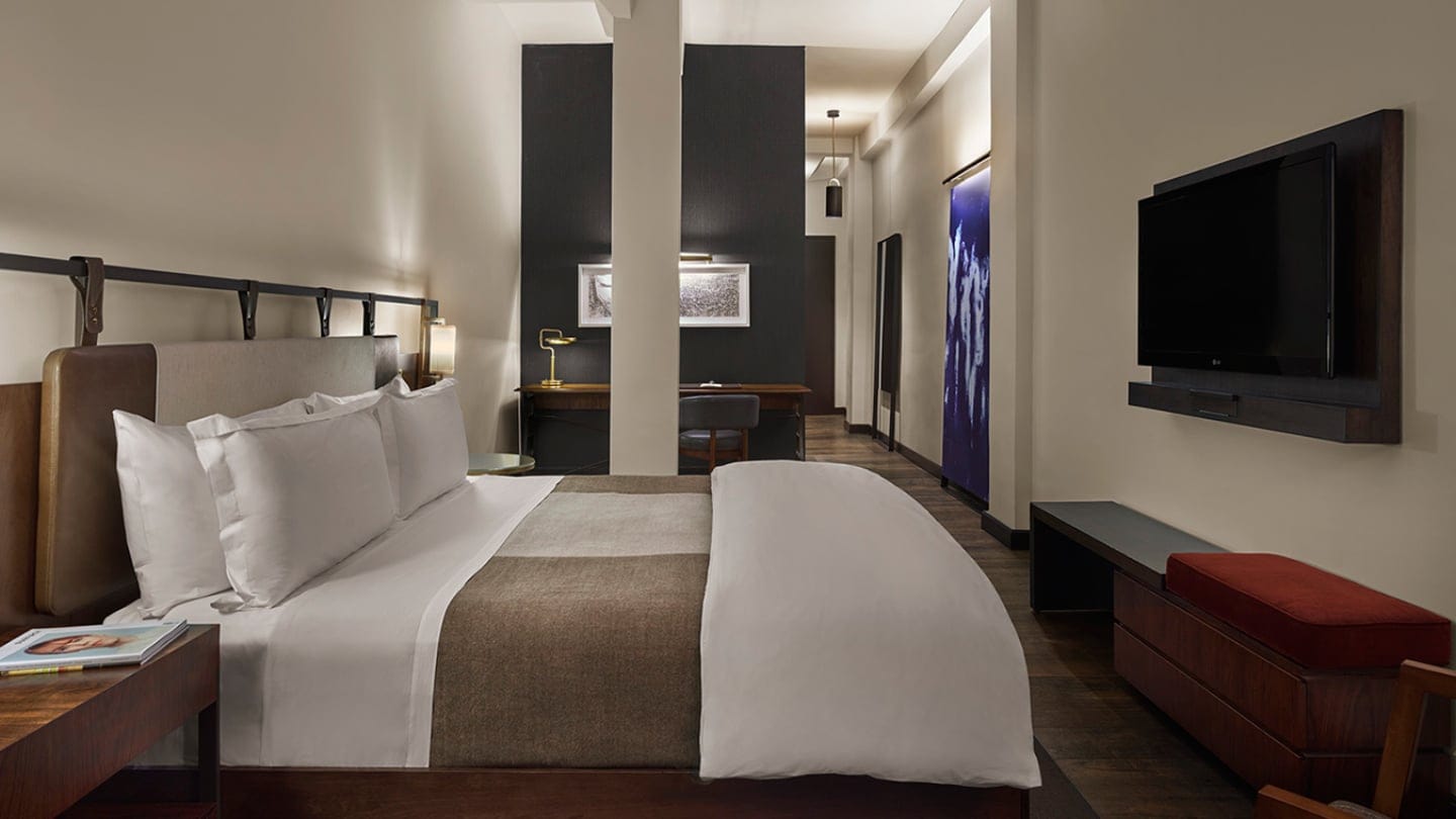 bedroom at refinery hotel new york