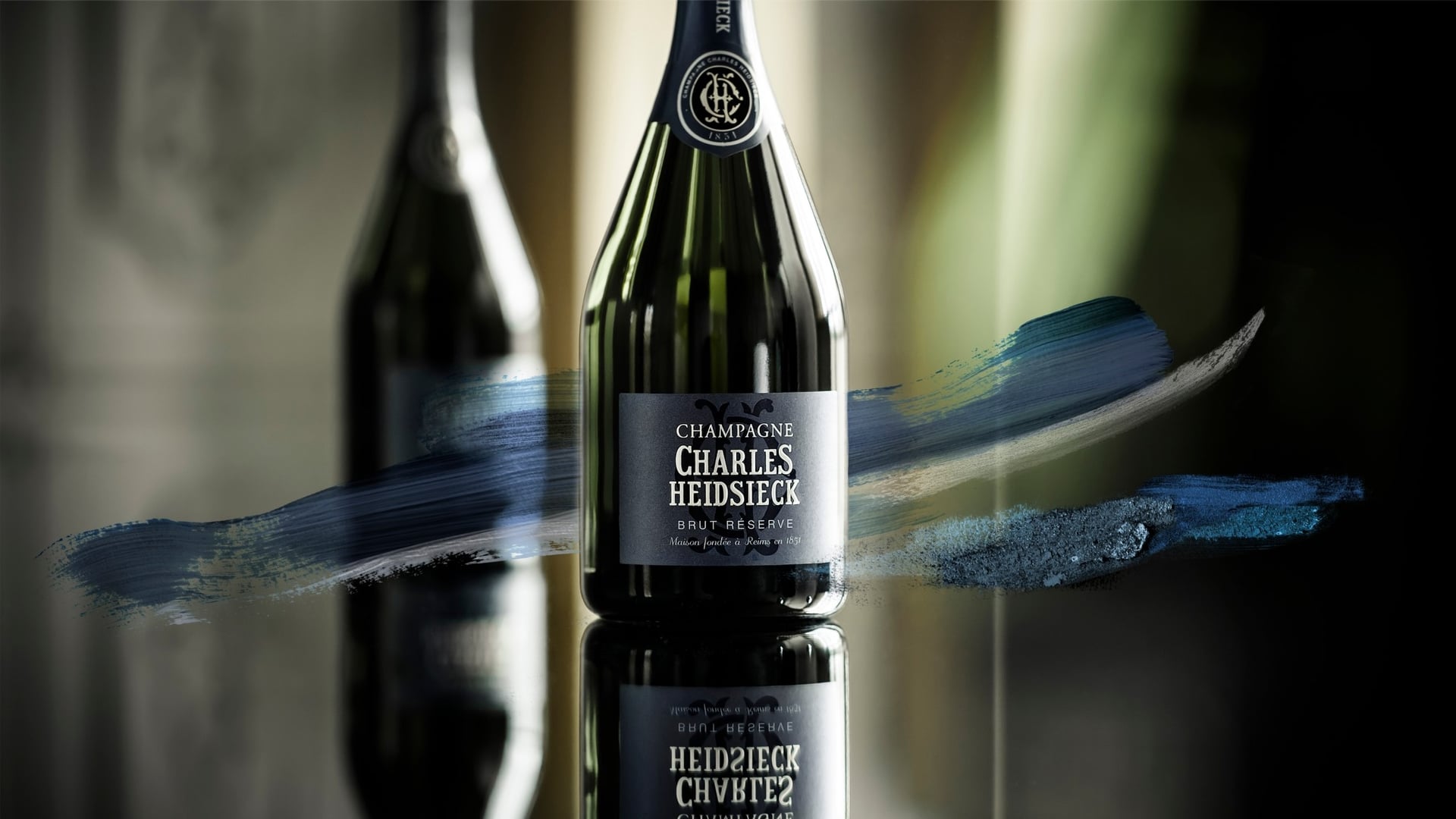 Charles Heidsieck champagne bottle on glass floor 