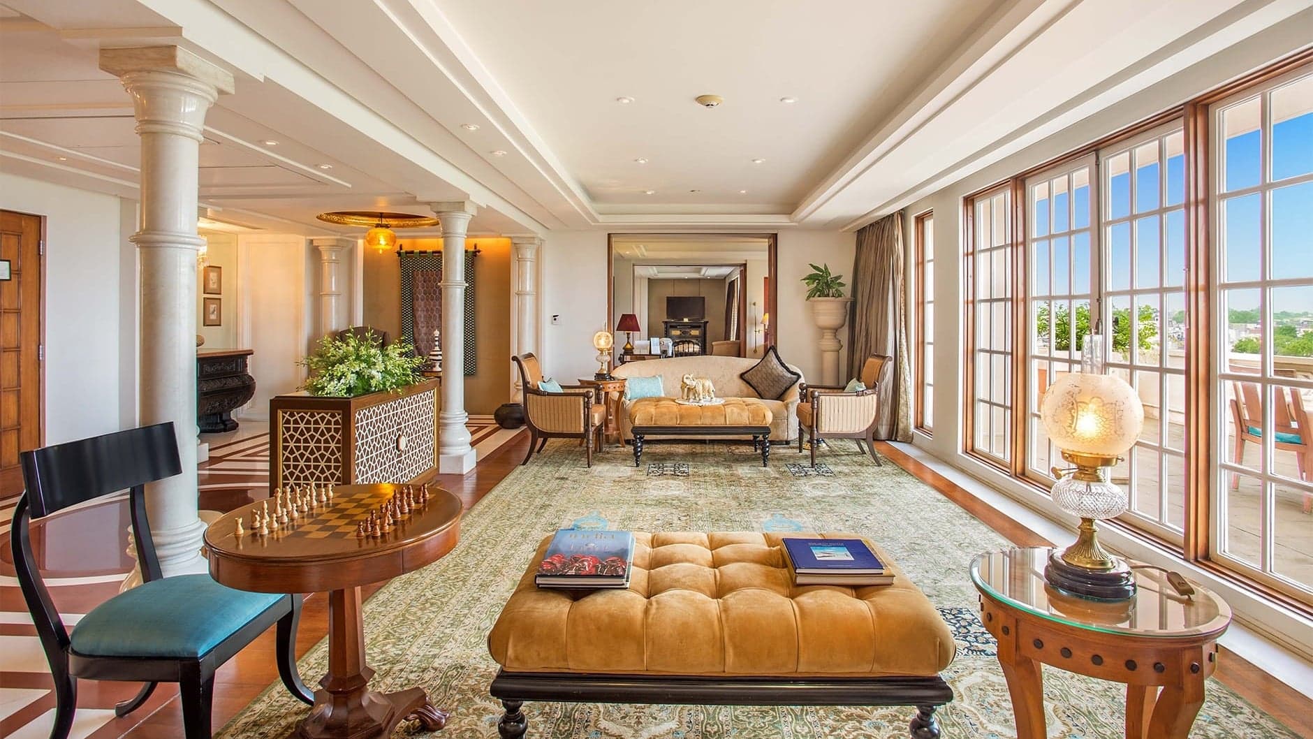 Lounge area at Oberoi Amarvillas with chess installed table and large windows