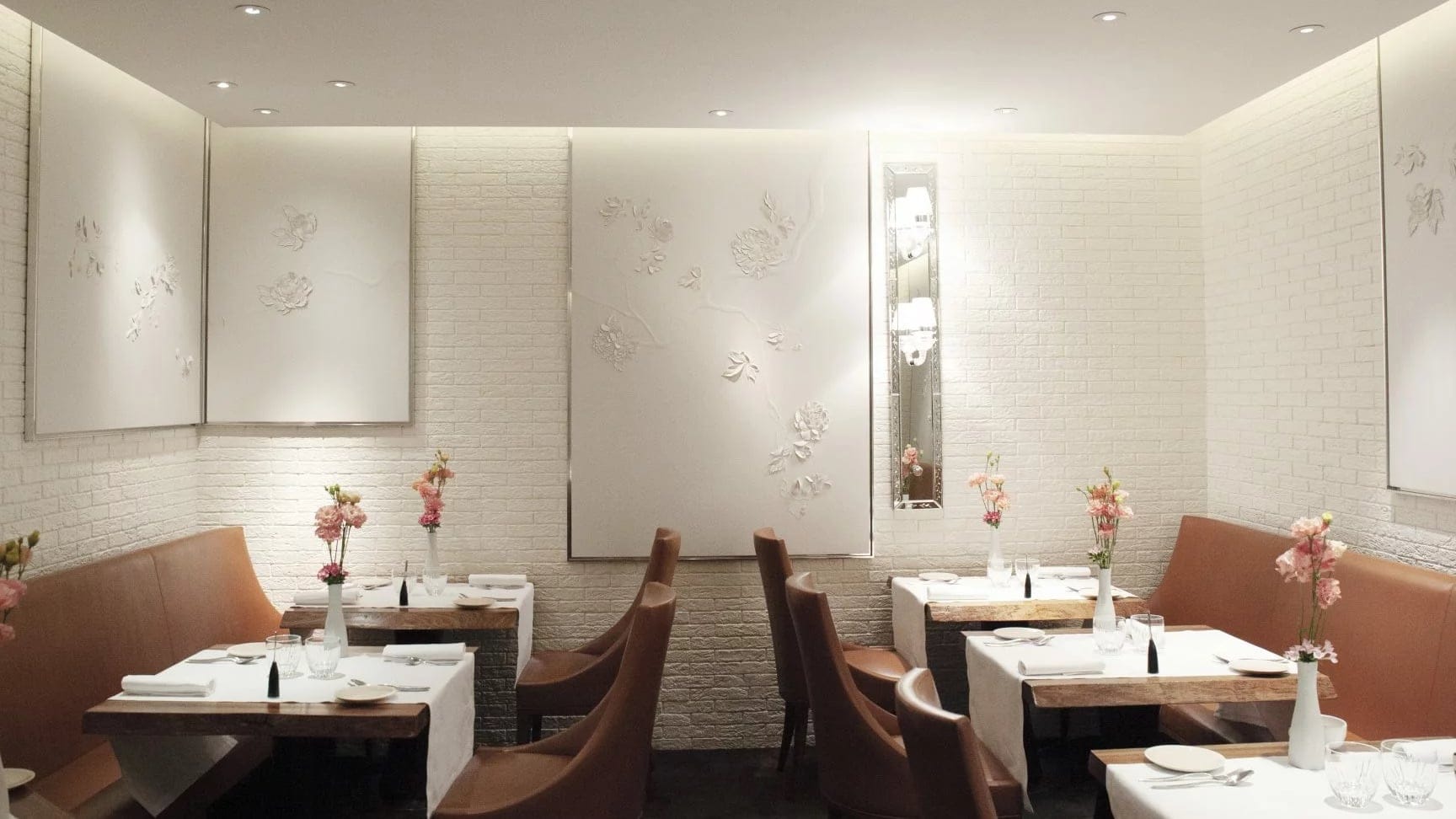 Resturant le dame de pic paris with brown chairs and white walls