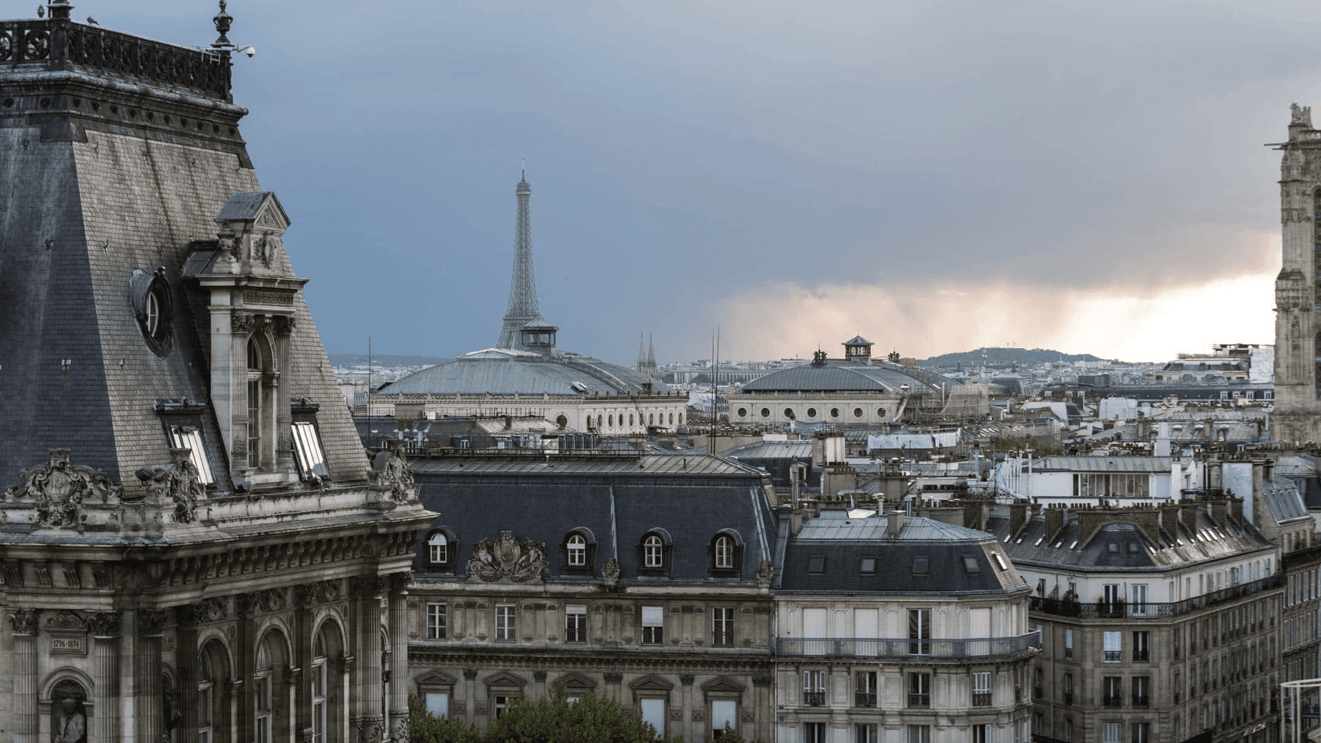 View of french architecture, the Eiffel Tower from Le Perchoir Marais. 