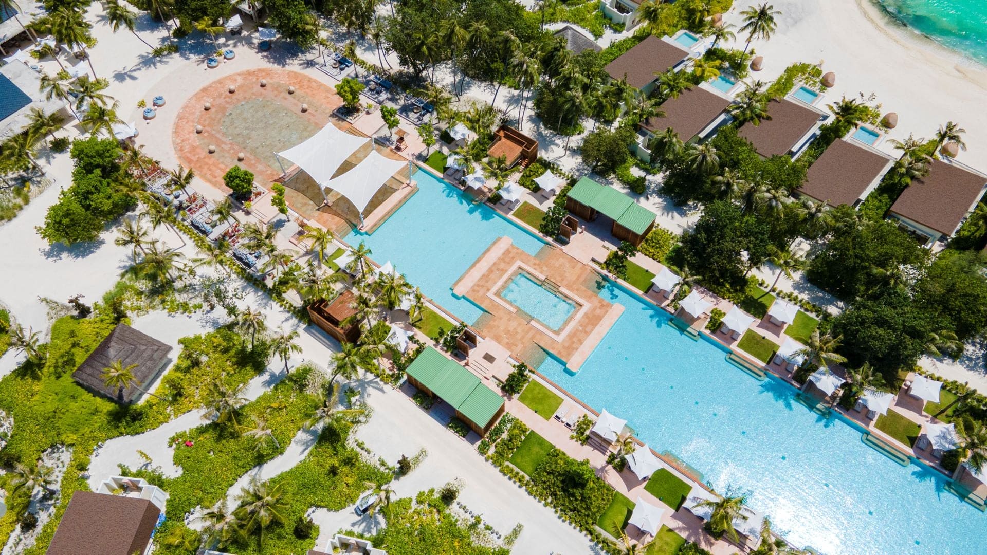Bird view of pool area and beach at Kuda Villingili.