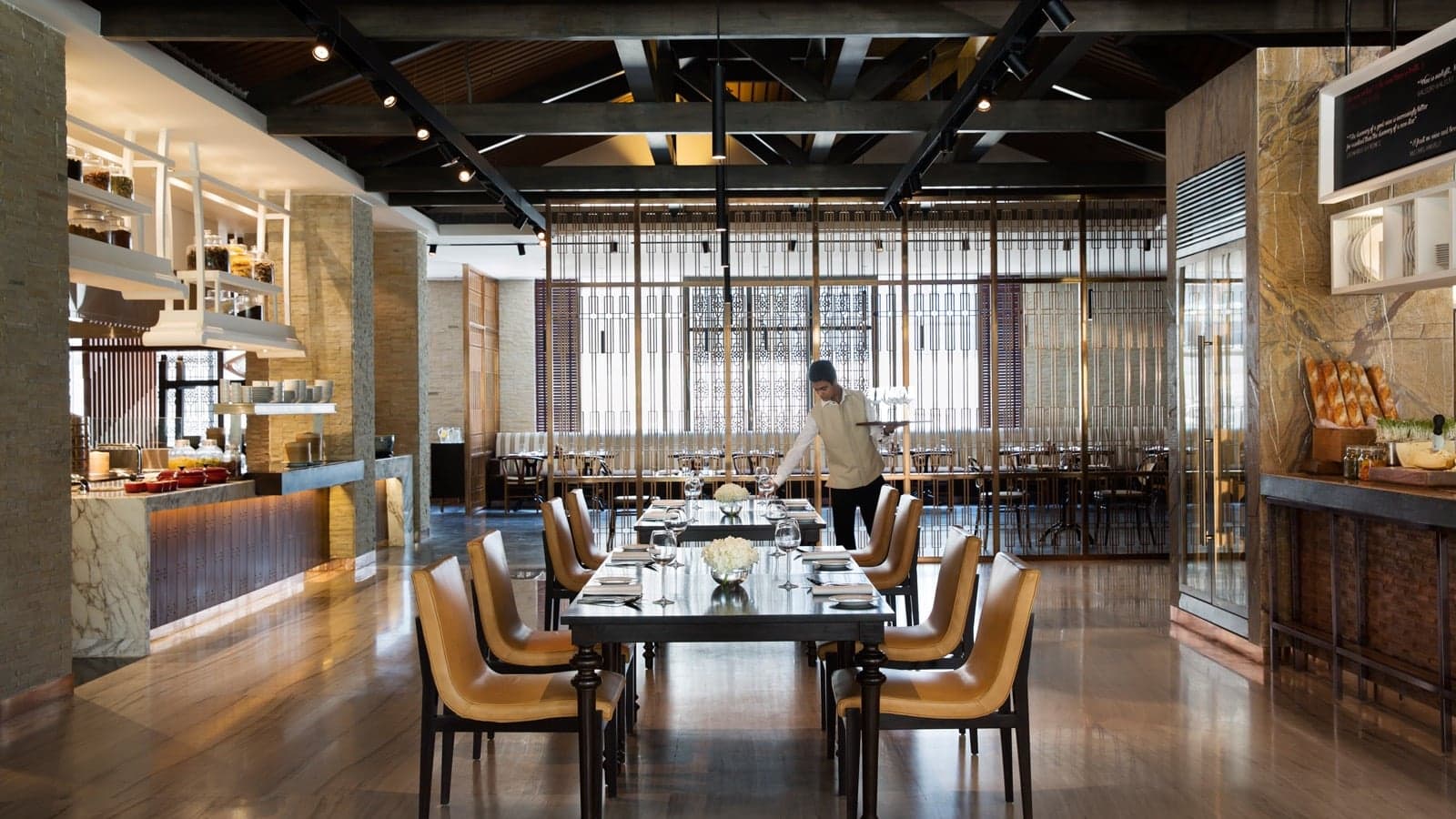 Dining area at the JW Mariott with a man in white
