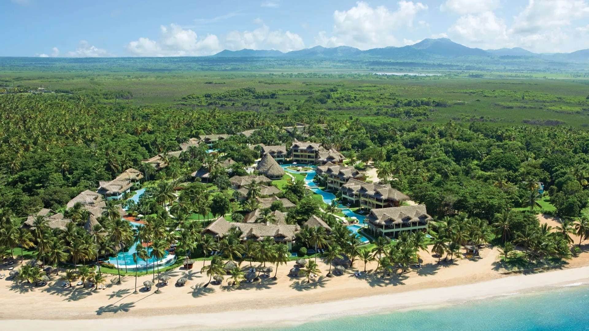 Zoëtry Agua Punta Cana with swimming pools and coconut trees around the resort
