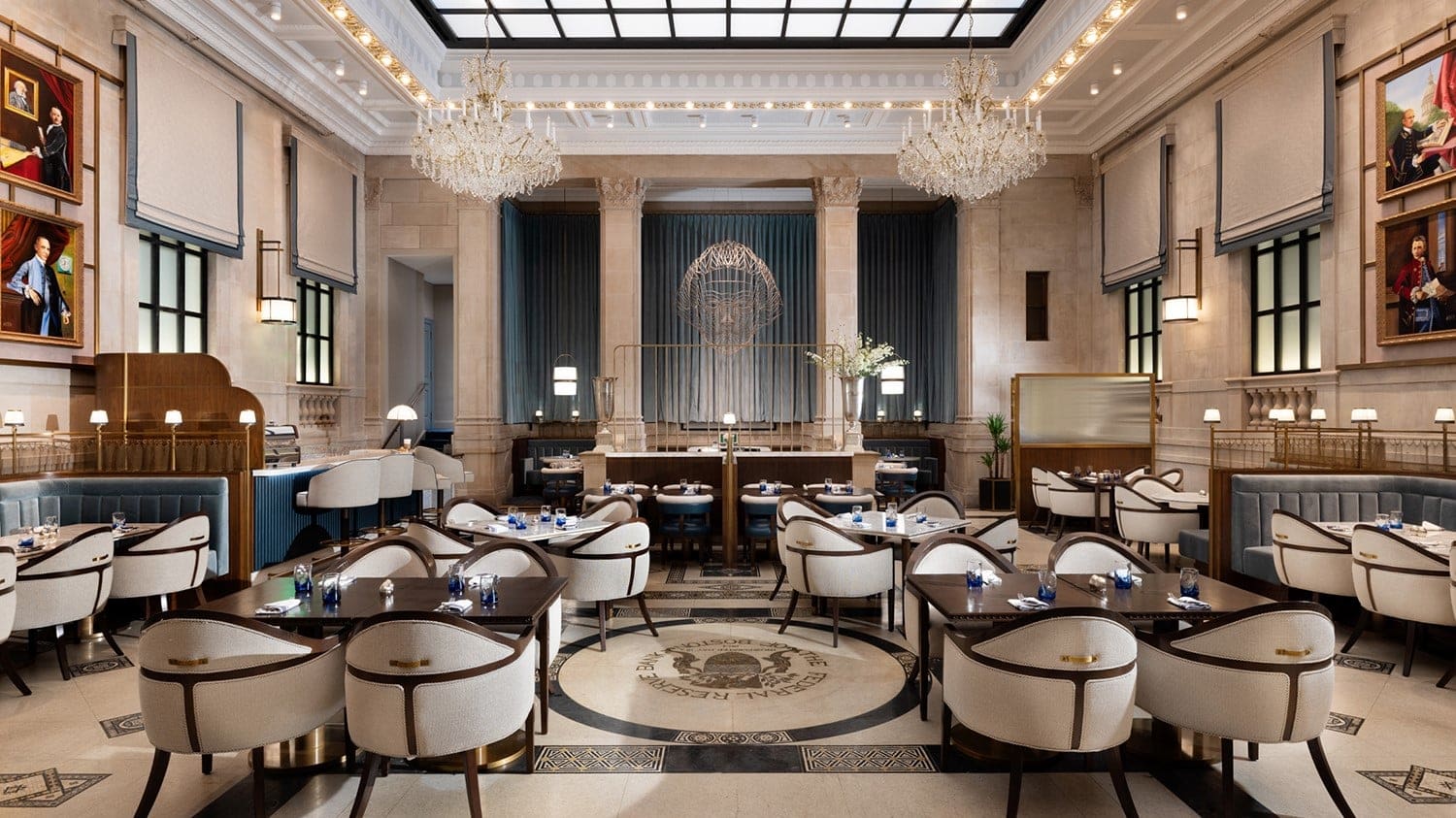 A resturant in the langham boston with paintings on the walls, and chairs and tables.